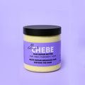 Skyn Fluent All Natural Chebe Hair Repair Butter jar with black lid and purple label, designed for high porosity hair to repair breakage and soften strands.