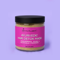 Ayurvedic hair detox mask in a clear jar with a pink label, featuring fenugreek, aloe, and triphala powder.