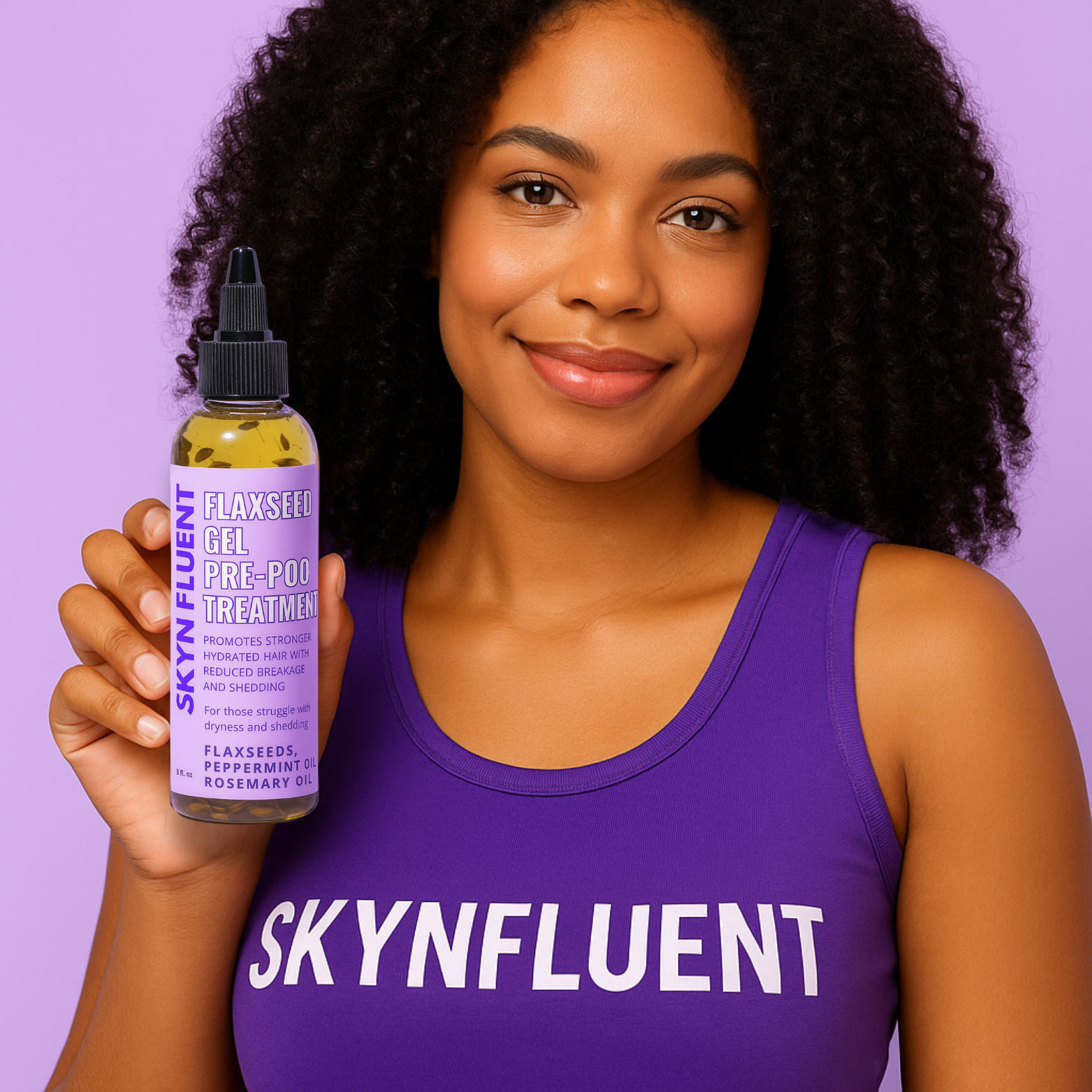 Woman with natural curly hair holding Skynfluent Flaxseed Gel Pre-Poo Treatment for strong, hydrated hair