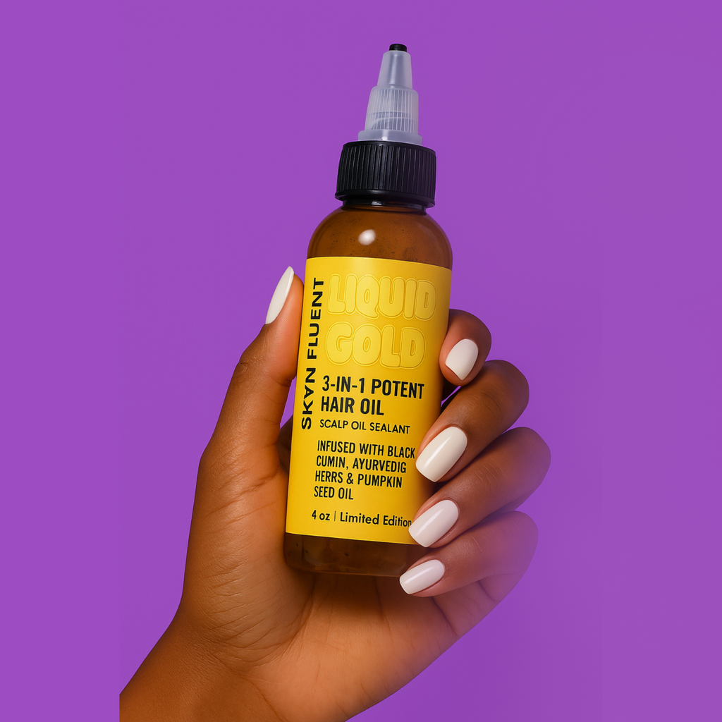 Skynfluent Liquid Gold 3-in-1 Hair Oil bottle held in hand on purple background – infused with black cumin, Ayurvedic herbs, and pumpkin seed oil.