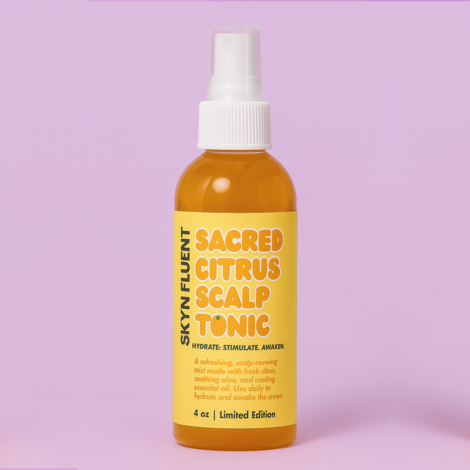 Skynfluent Sacred Citrus Scalp Tonic bottle on pink background – hydrating scalp mist infused with citrus, aloe, and peppermint oil.